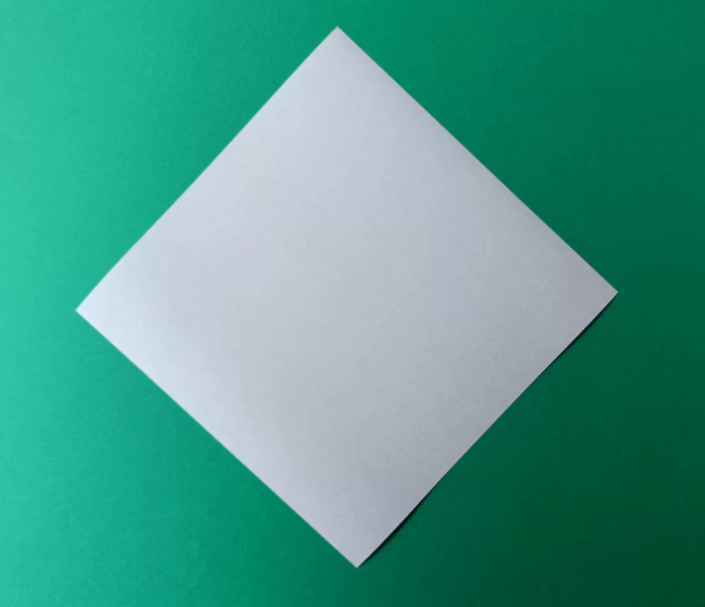 Place your paper on the table like a diamond shape