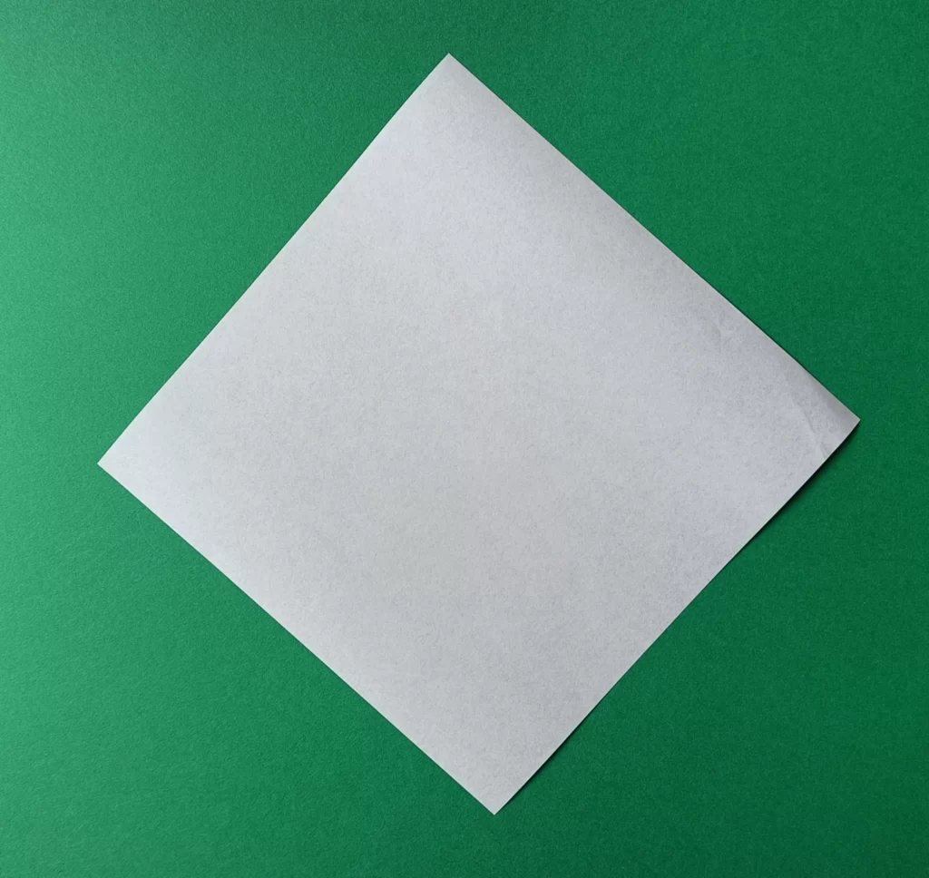 Place your square paper on the table like a diamond