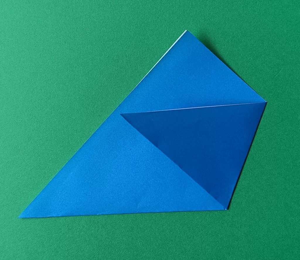 Fold the right corner to the left side