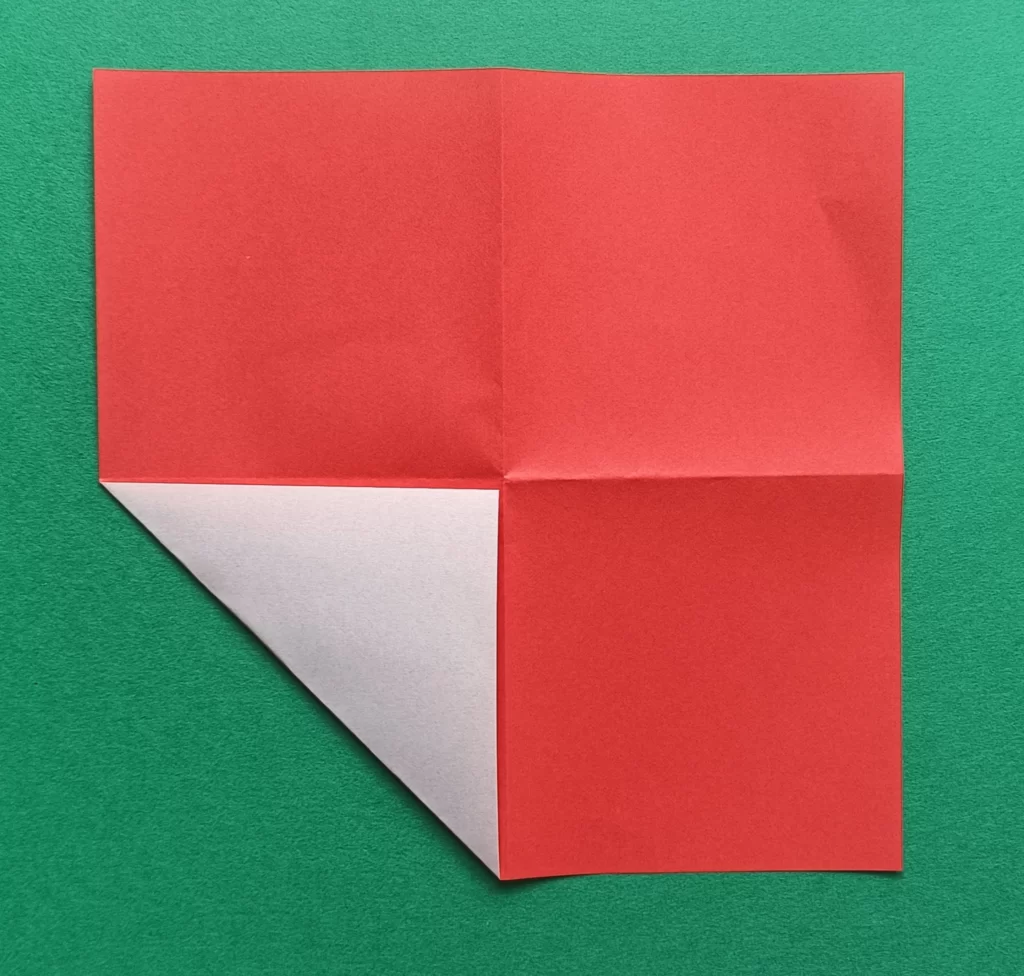 Fold the bottom left corner to the middle