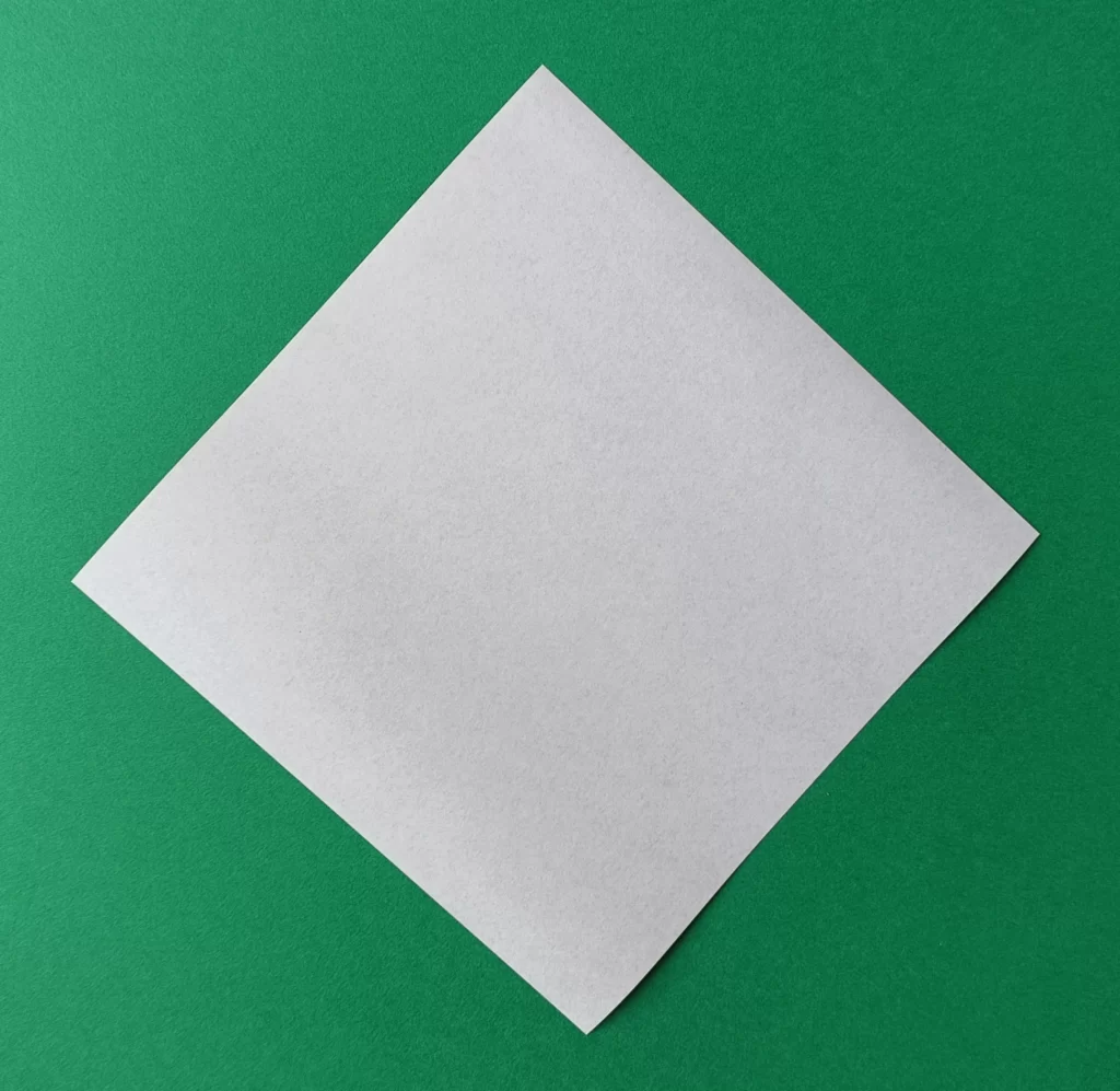 Place your square paper on the table like a diamond