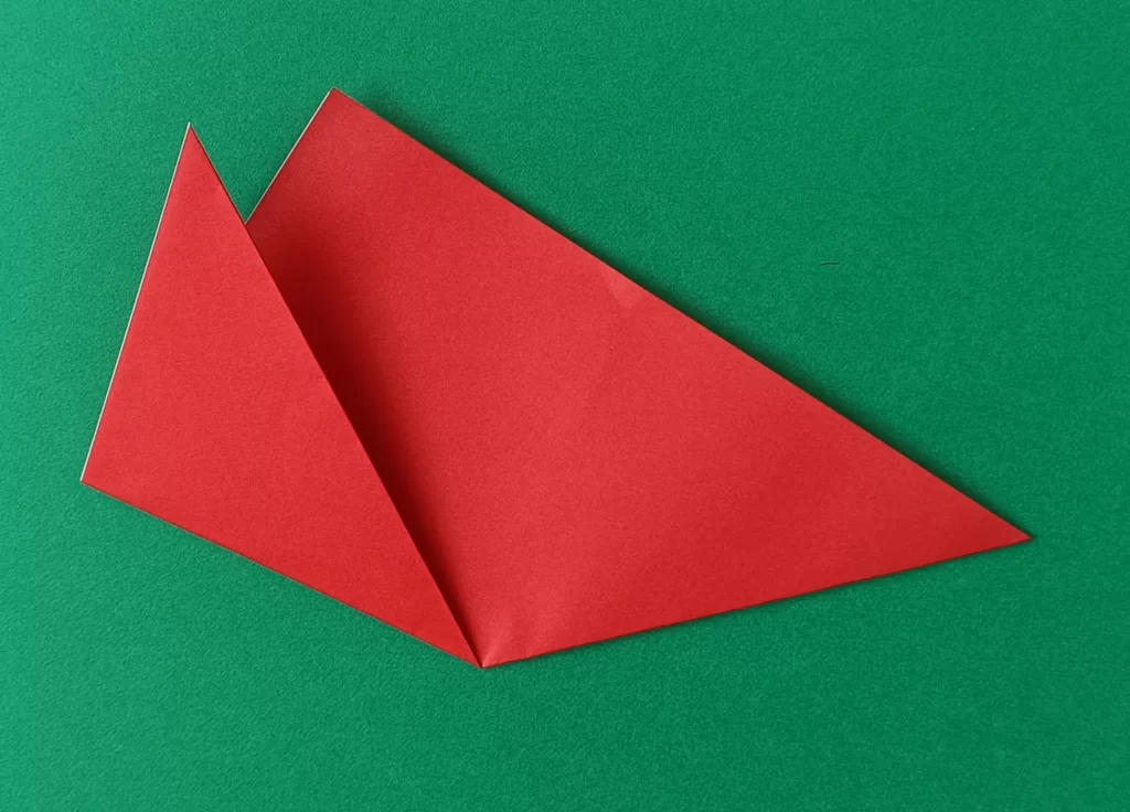 Fold the left corner up to make a petal