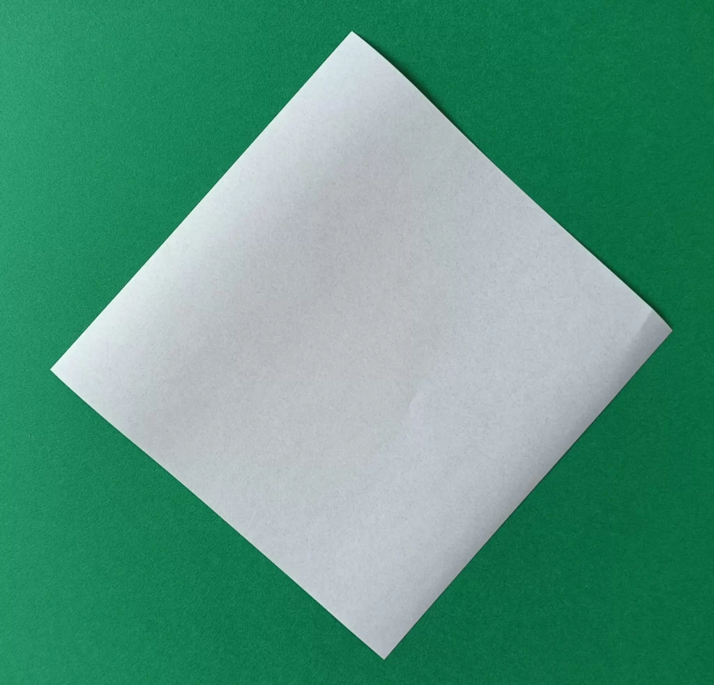 Place your square paper on the table like a diamond