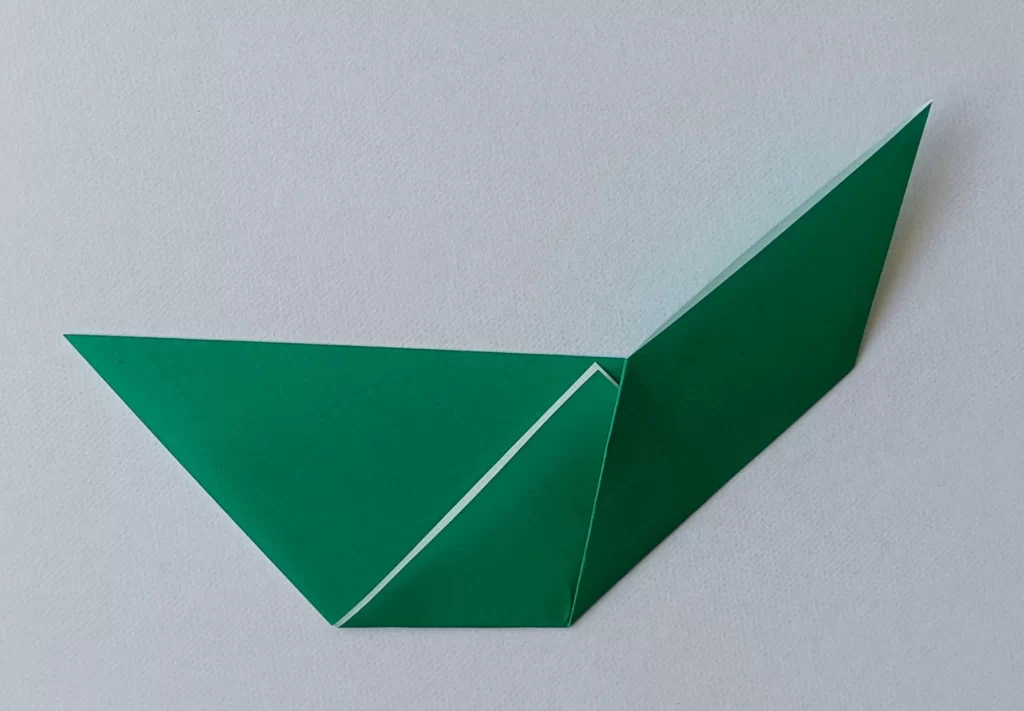 Fold the right corner up from the center