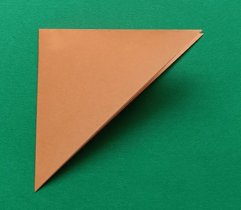 Fold the triangle in half again