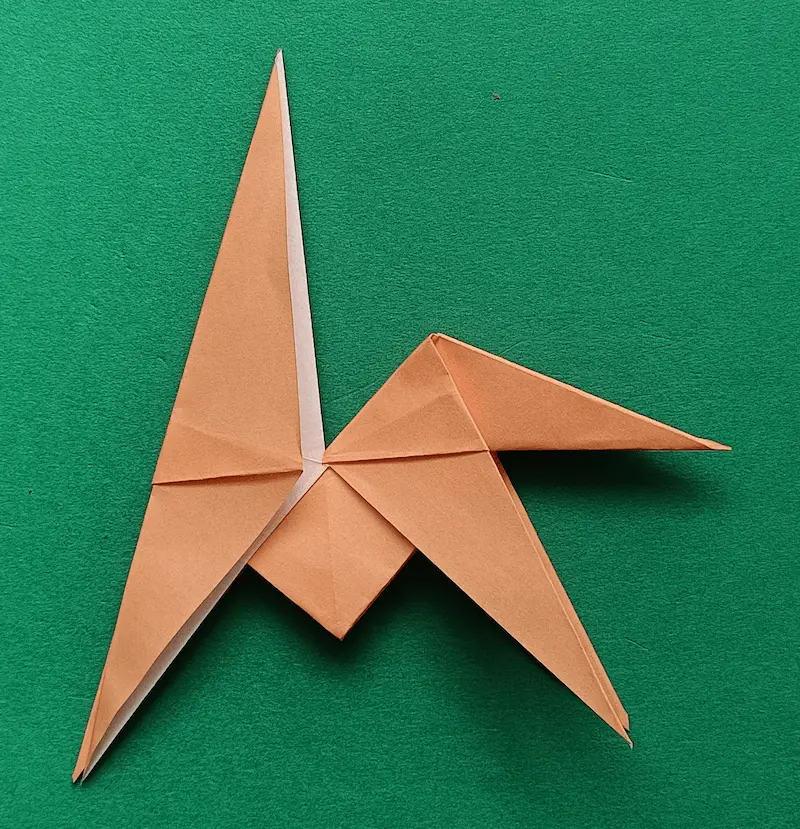 Make an inside reverse fold at the right corner to create a tail