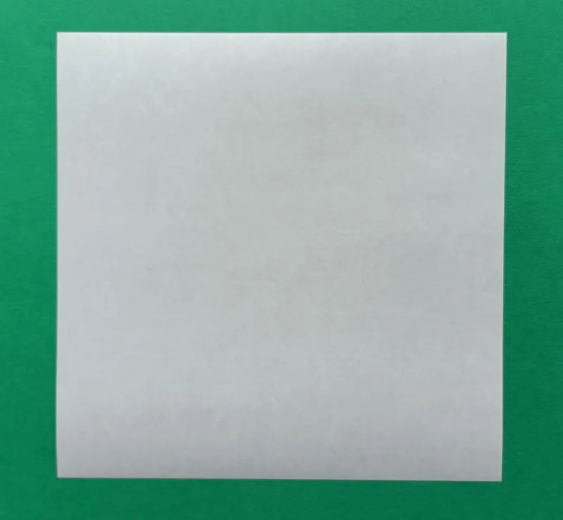 Place the square paper flat on the table