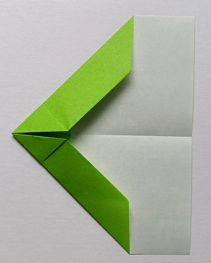 As you see in the photo, fold both the top and bottom edges to meet the center crease (upside)