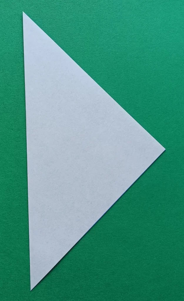 Fold the paper in half by touching the side corners