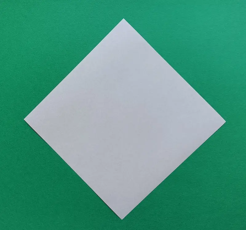 Place your paper on the table like a diamond shape