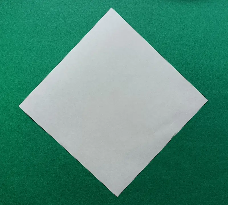 Place your paper on the table like a diamond shape