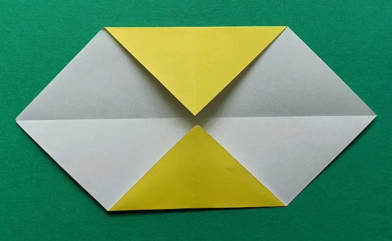 Fold the top corner down to the middle