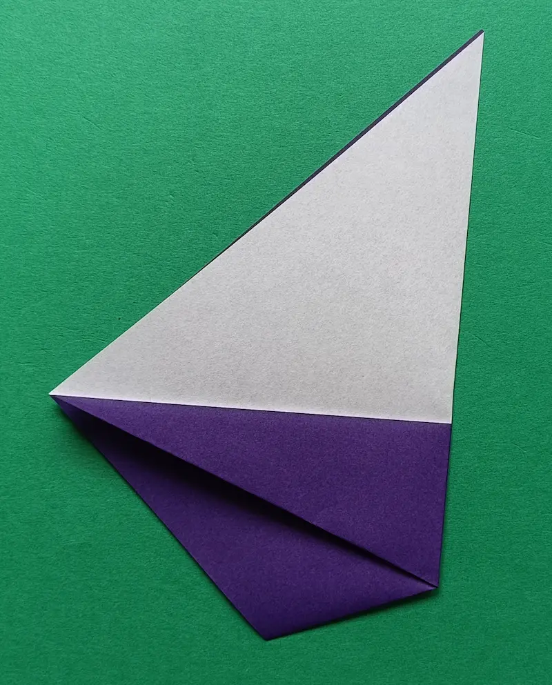 Fold the right corner over to the left corner