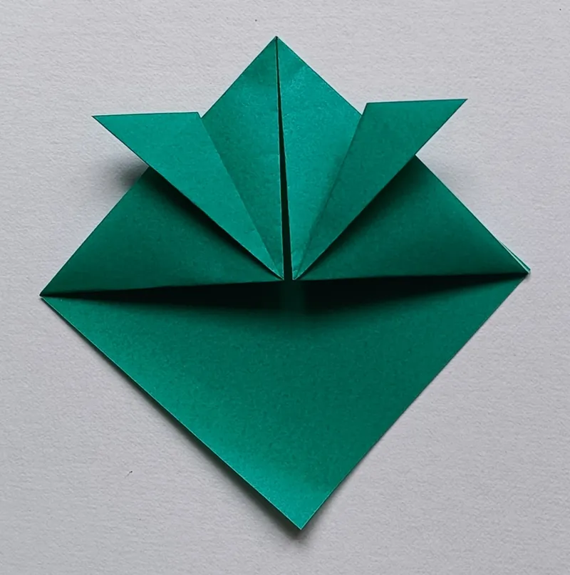 Fold the same right flap up and out to the side