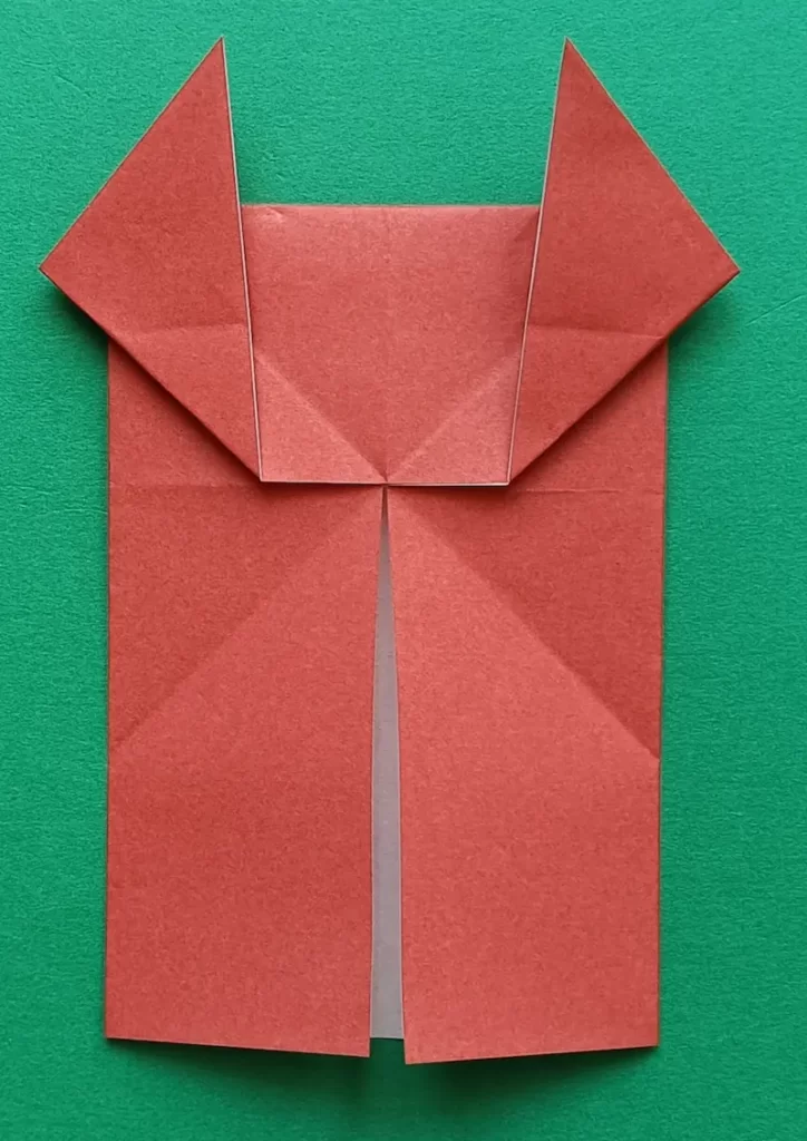 Take the right corner and fold it upwards