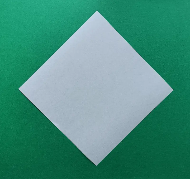 Place your paper on the table like a diamond shape
