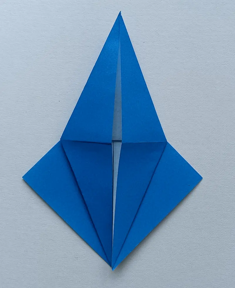 (2) Fold up the top layer to the crease to make a diamond shape