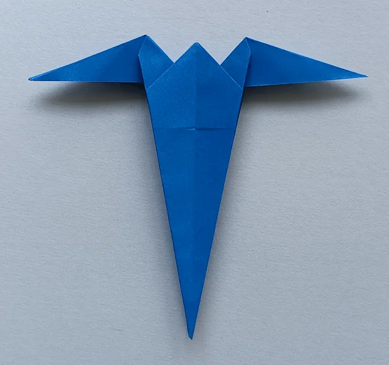 Make an inside reverse fold at both top corners to create wings