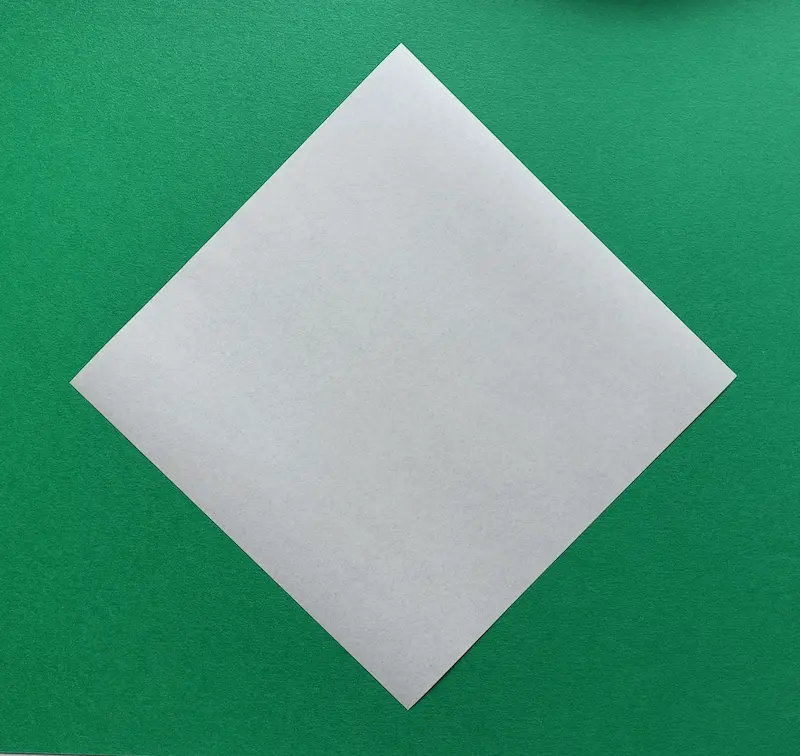 Place your square paper on the table like a diamond.