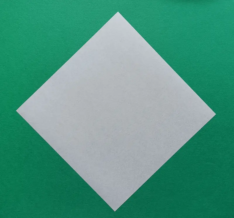 Place your square paper on the table like a diamond