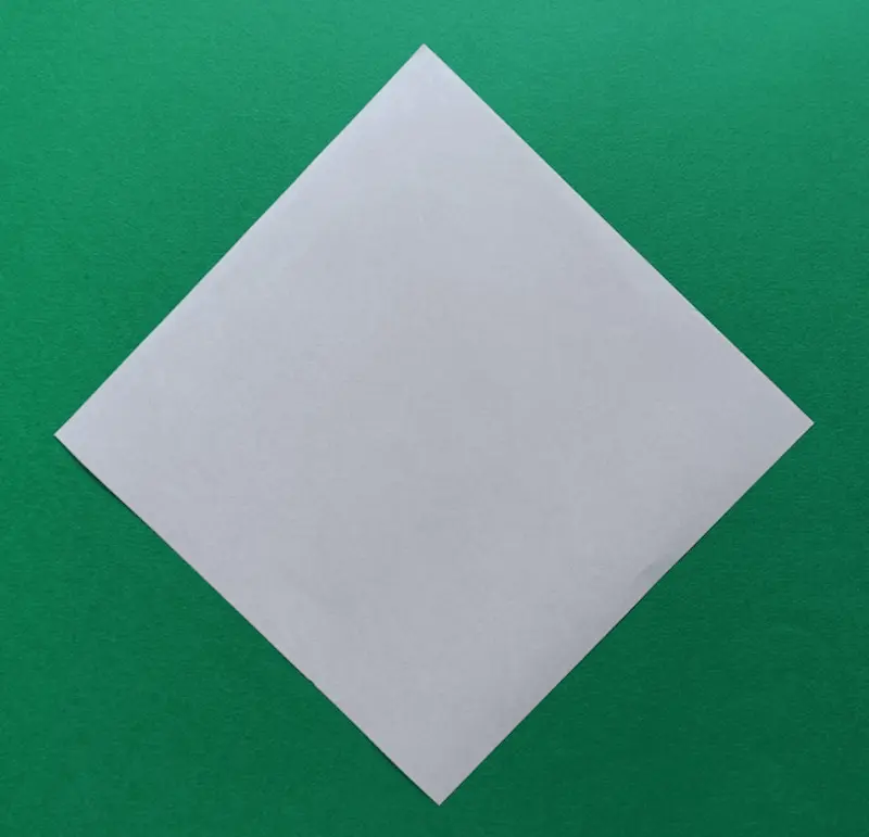 Place your paper on the table like a diamond shape