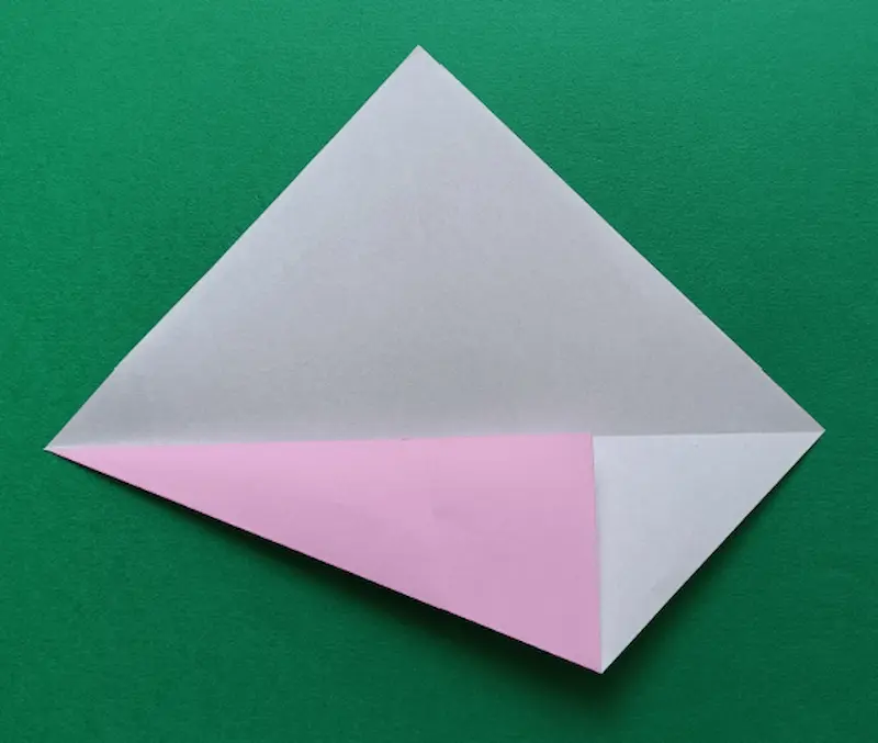 Fold the bottom corner to meet the center crease