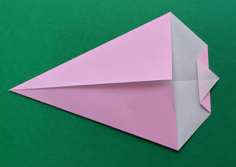 Fold the corner from Step 5 to the right. (Let the tip peek out a little bit.)