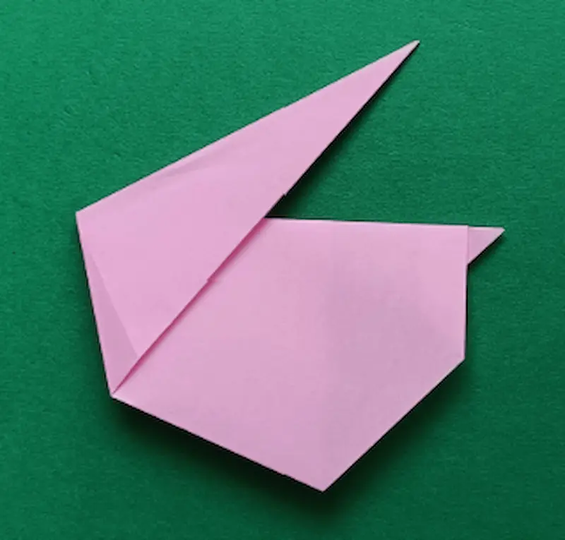 Pinch the triangle and lift it up to make an ear