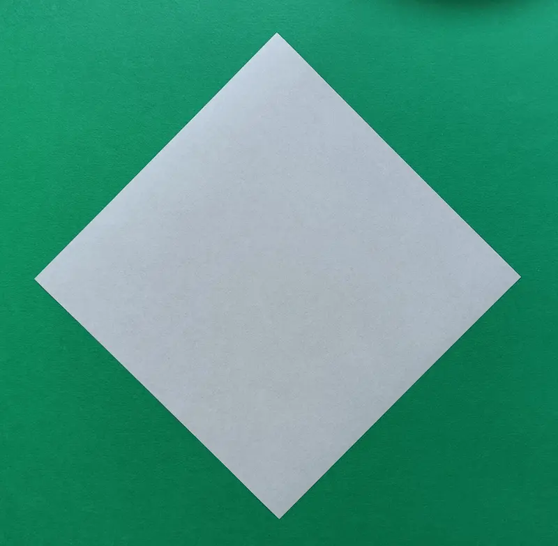 Place your paper on the table like a diamond shape
