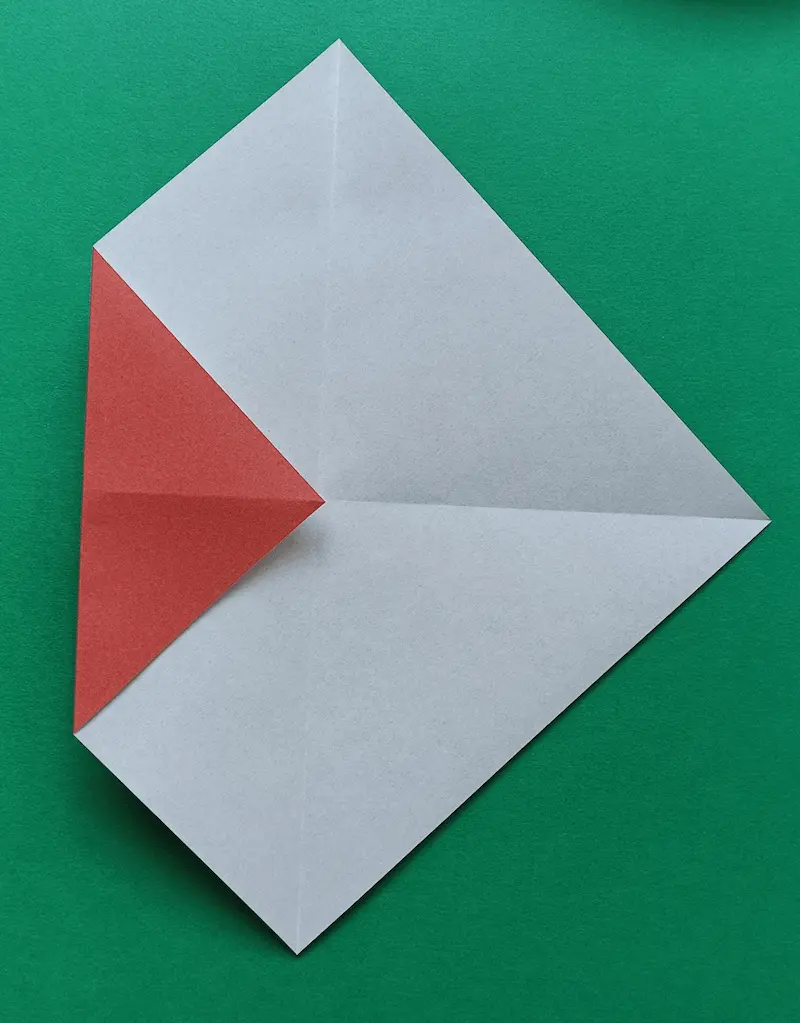 Fold the left corner to the center
