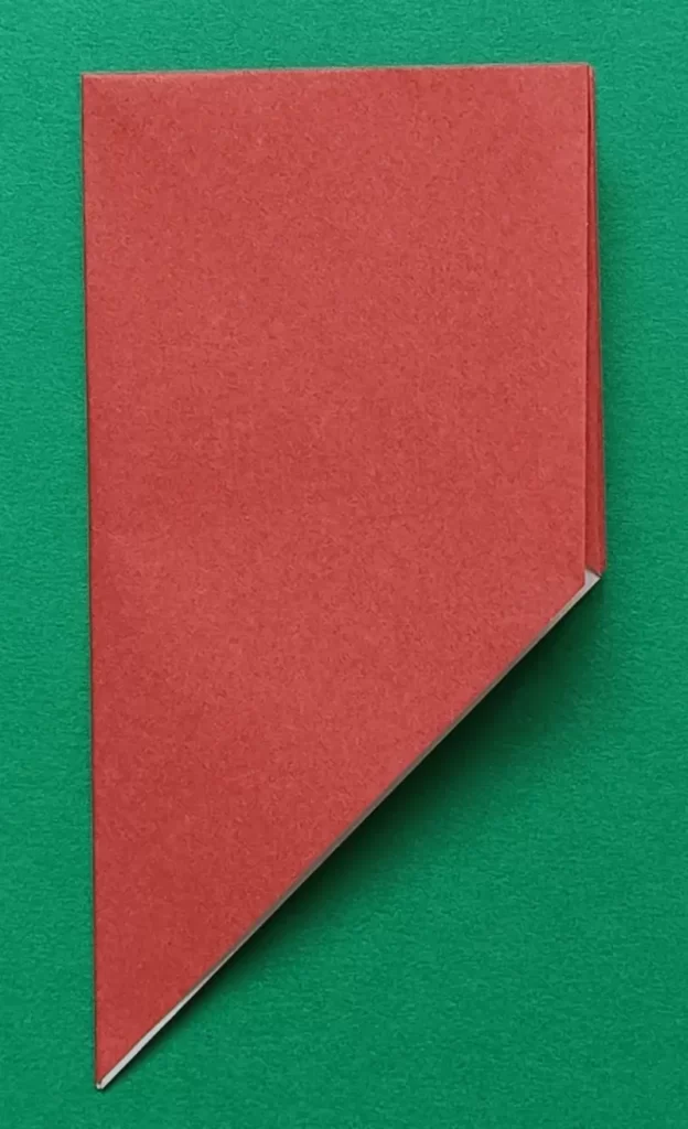 Fold the paper in half from left to right