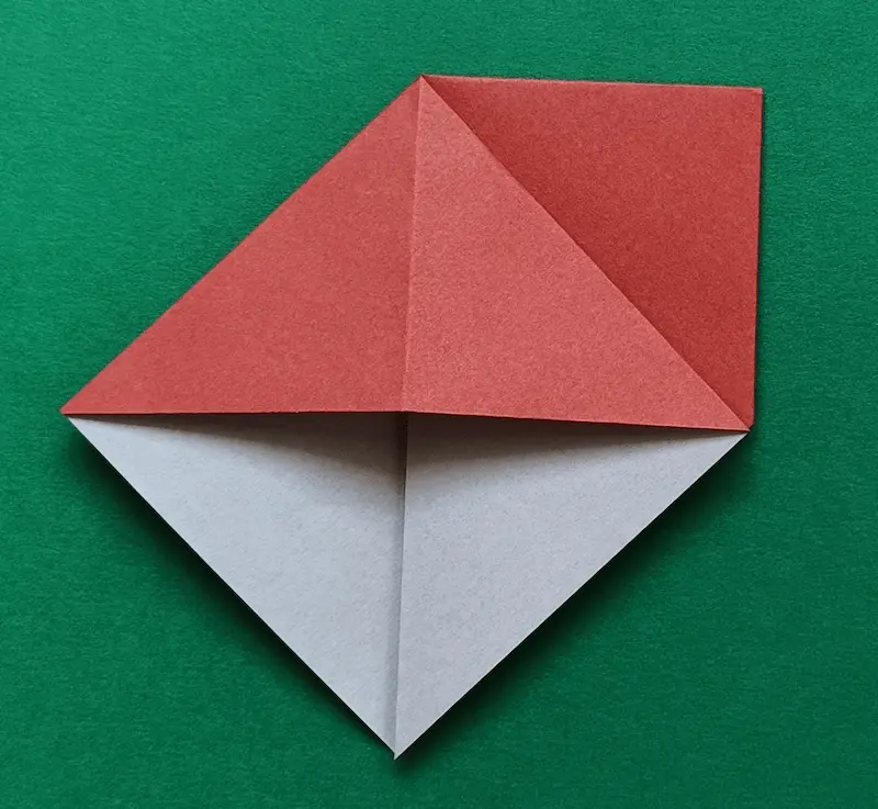 Put your finger in the top layer of paper, open it up, and flatten it