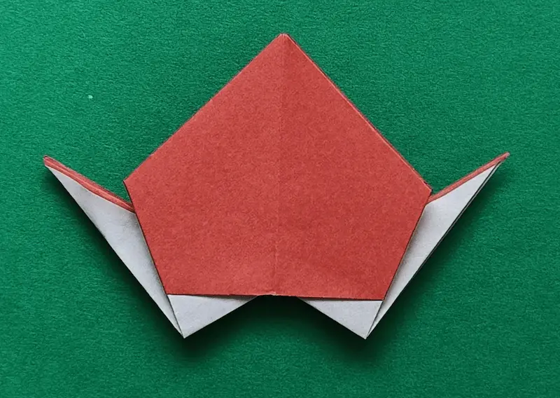 Make an inside reverse fold at bottom right corner